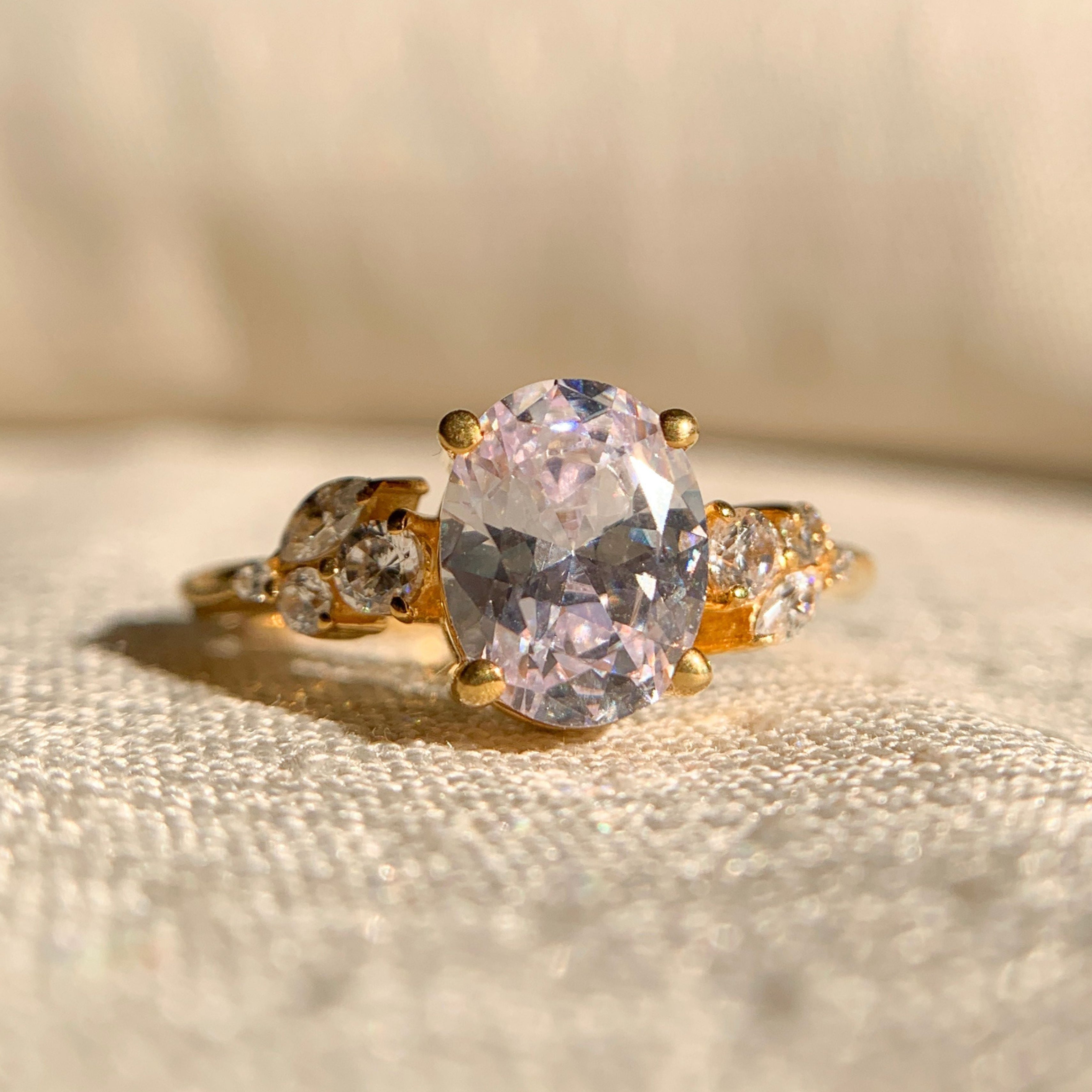 1.75CT oval side stone engagement ring in 14k gold